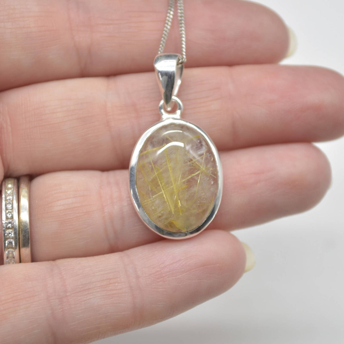 Golden Rutilated Quartz Oval Pendant in Sterling Silver