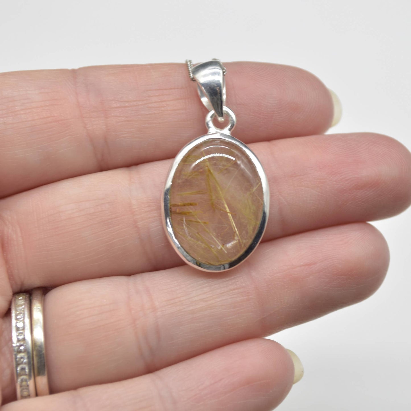 Golden Rutilated Quartz Oval Pendant in Sterling Silver