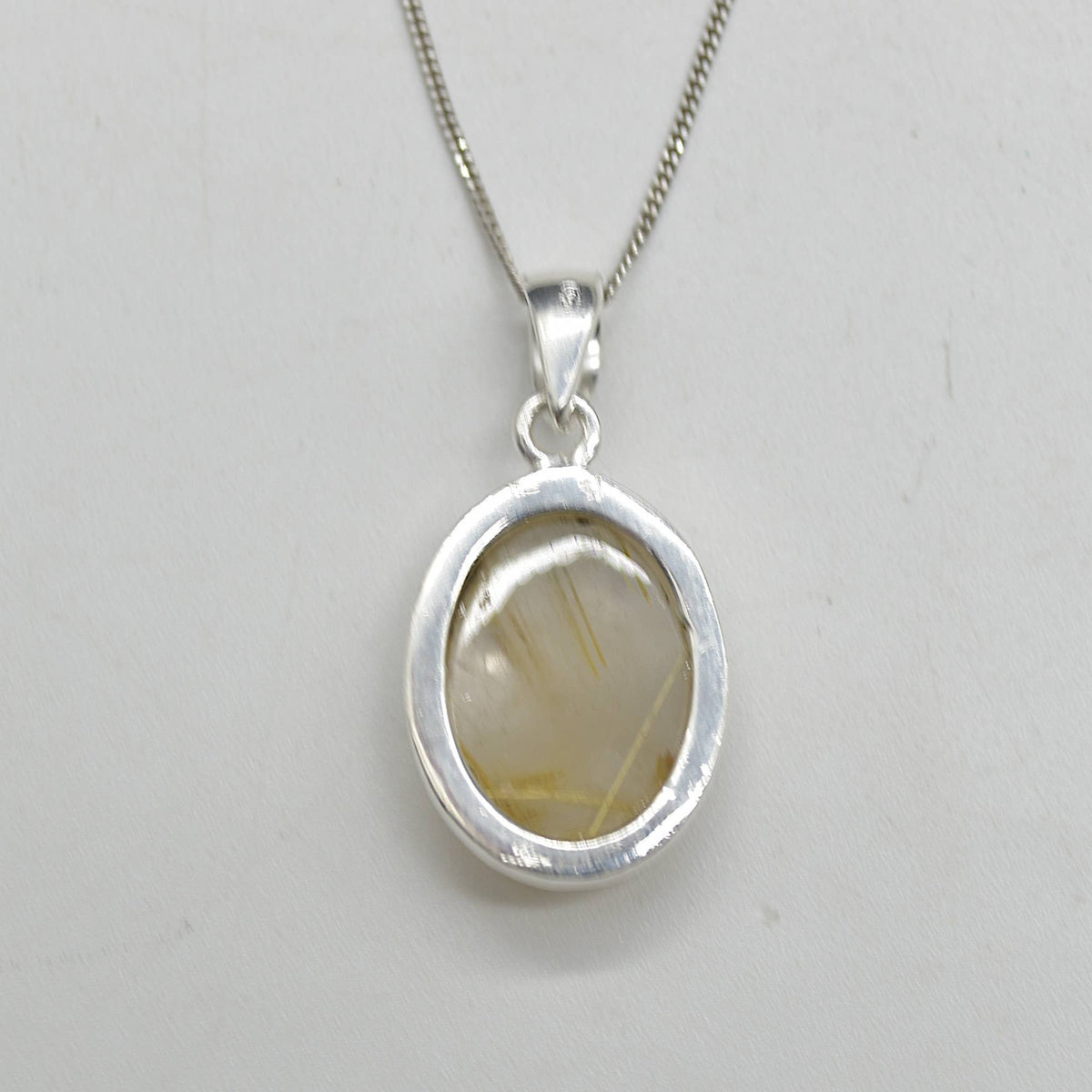 Golden Rutilated Quartz Oval Pendant in Sterling Silver