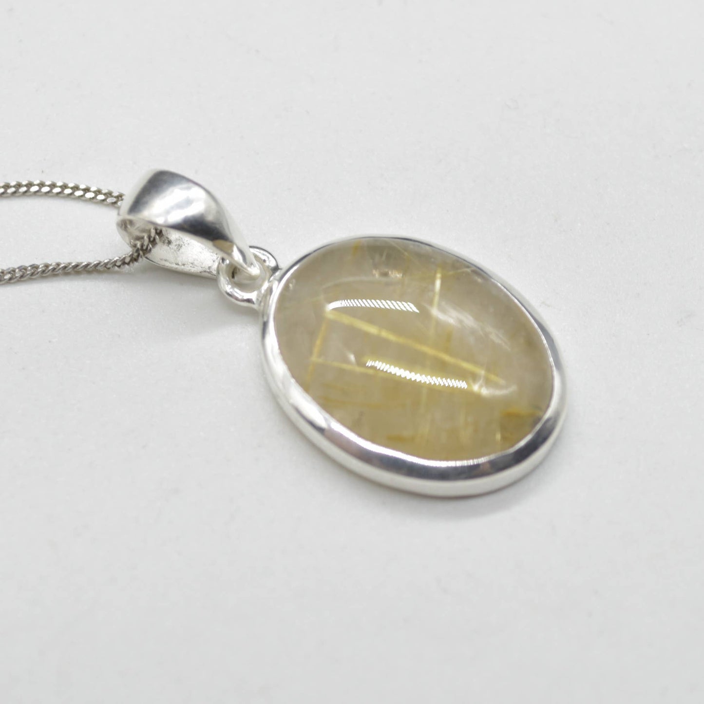 Golden Rutilated Quartz Oval Pendant in Sterling Silver