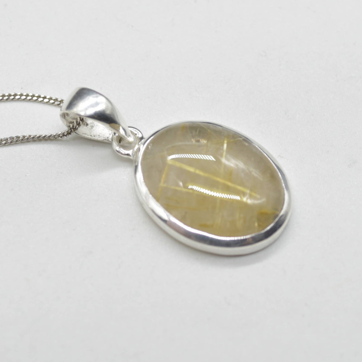 Golden Rutilated Quartz Oval Pendant in Sterling Silver